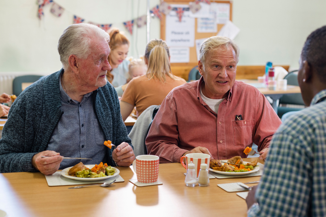 Group of carers eating food together at the Leicester Carers Cafe Support session