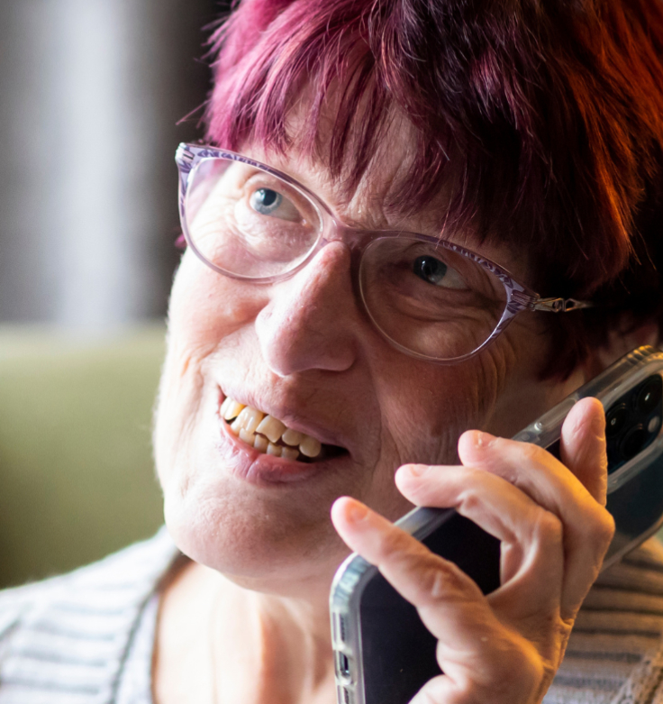 Old lady on phone smiling