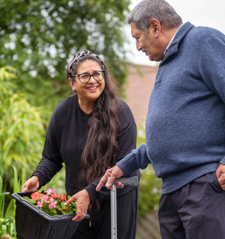Father and daughter out in the garden