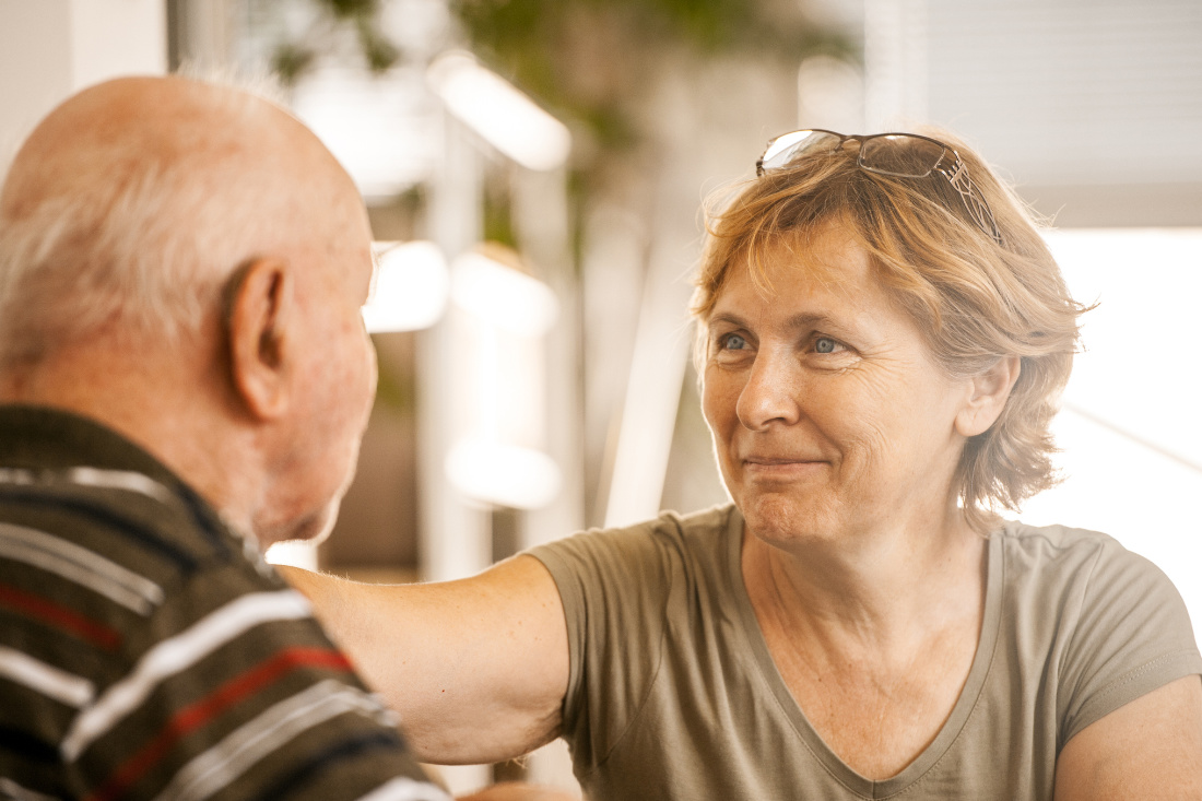 Wife with hand on husbands shoulder discussing lasting power of attorney