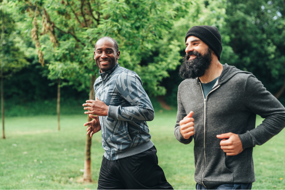 two men running in a park