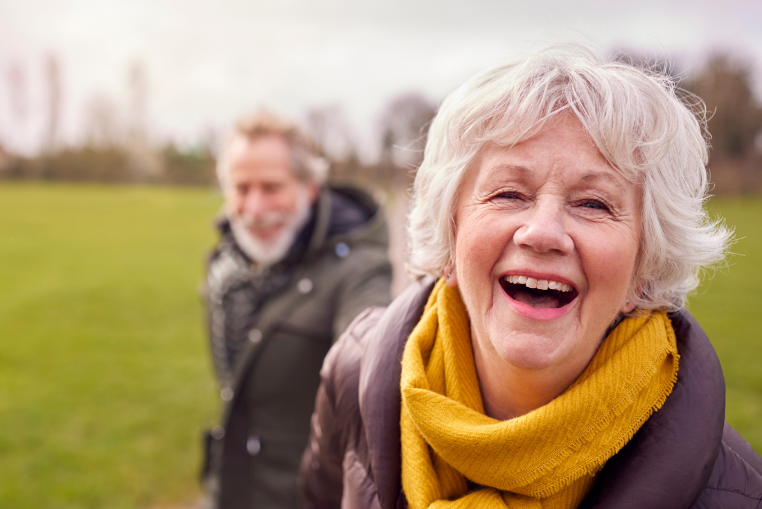 older couple walking in park