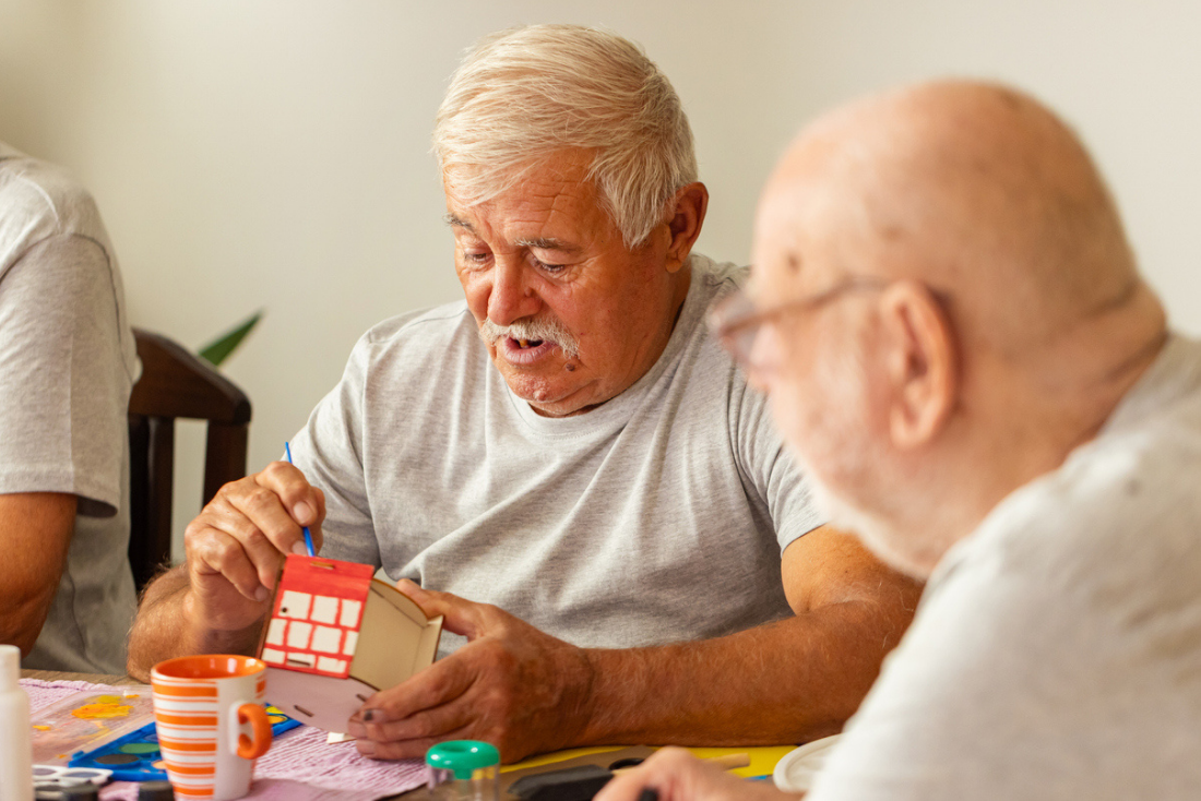 two men enjoying arts and crafts
